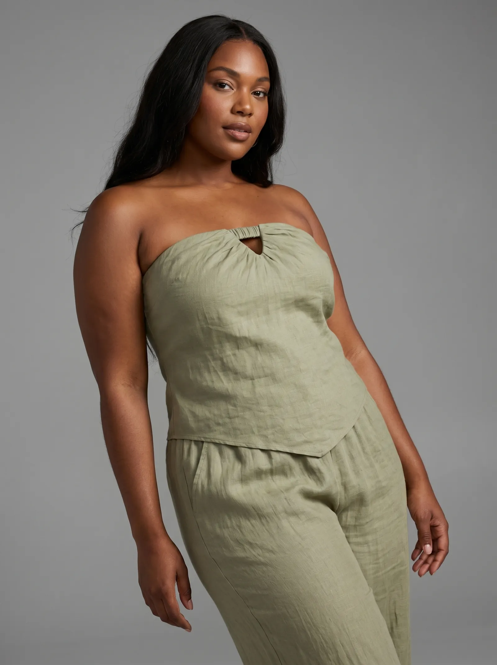 AI-generated on-model imagery — sage draped dress